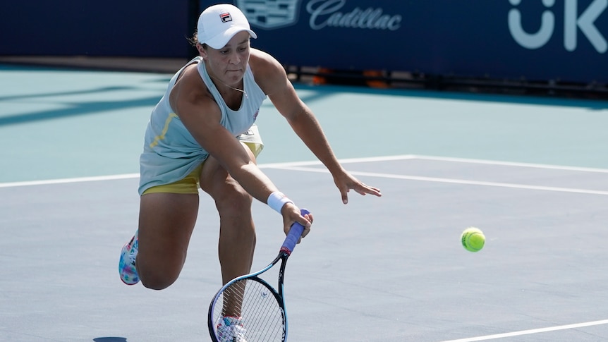 Ash Barty hits a return to Aryna Sabalenka at the Miami Open