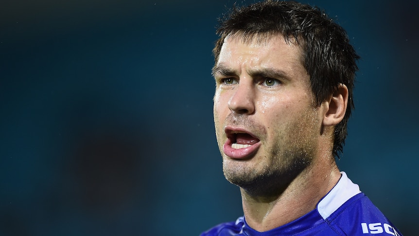 A Newcastle Knights NRL player looks on during a match in 2015.