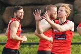 Conor McKenna trains with Essendon Bombers AFL teammates.