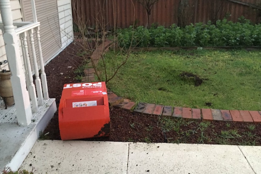 A letterbox in the front yard of a house in Glenroy after a crash