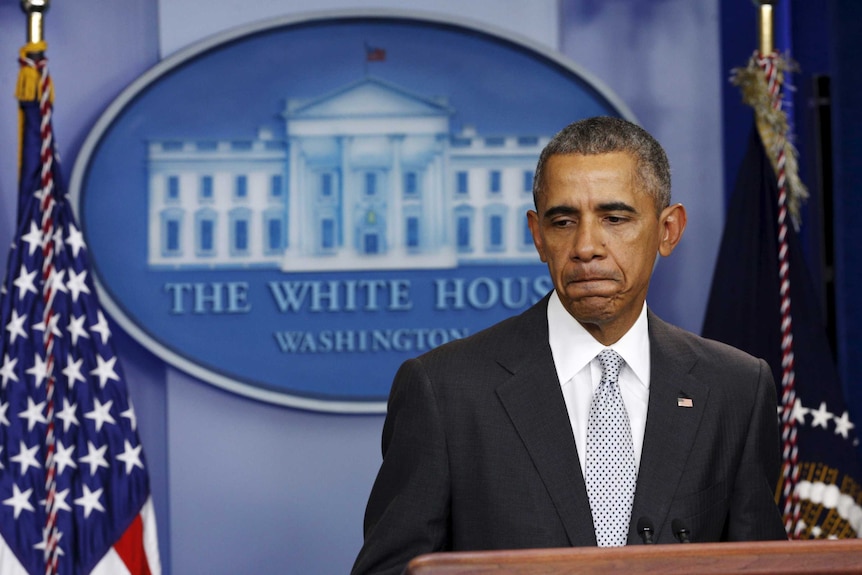 Barack Obama pauses during his speech