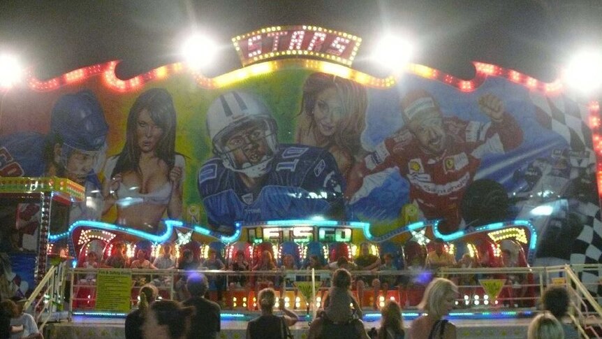 McGregor's Family Carnival mural at night