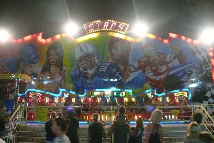 McGregor's Family Carnival mural at night