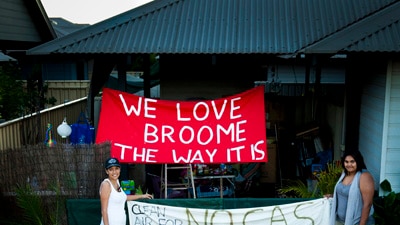 Broome residents with anti gas hub signs.