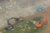 Diggers work inside Sydney Stadium at Moore Park.