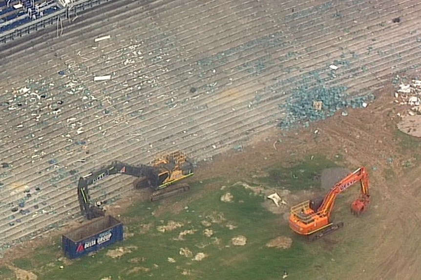 Diggers work inside Sydney Stadium at Moore Park.
