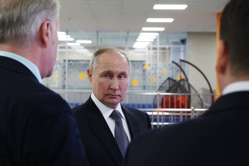 Russian President Vladimir Putin visits a secondary school in Arkhangelsk.