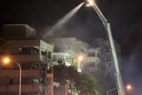 Water crane tackles Cathedral Place unit complex fire