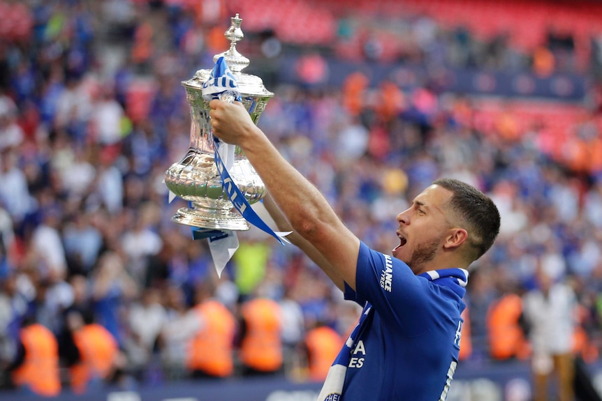 Chelsea's Eden Hazard celebrates with the trophy after winning the English FA Cup