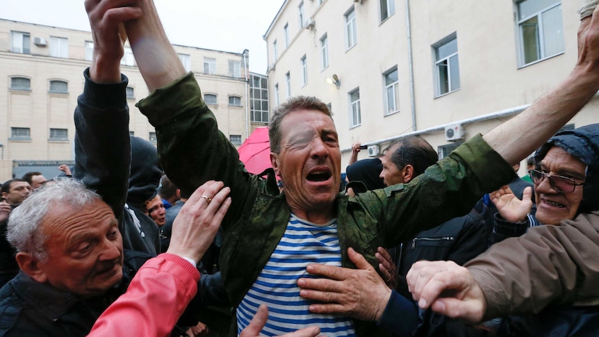 Protesters welcome a man released from Odessa police HQ