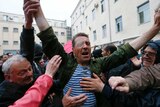 Protesters welcome a man released from Odessa police HQ