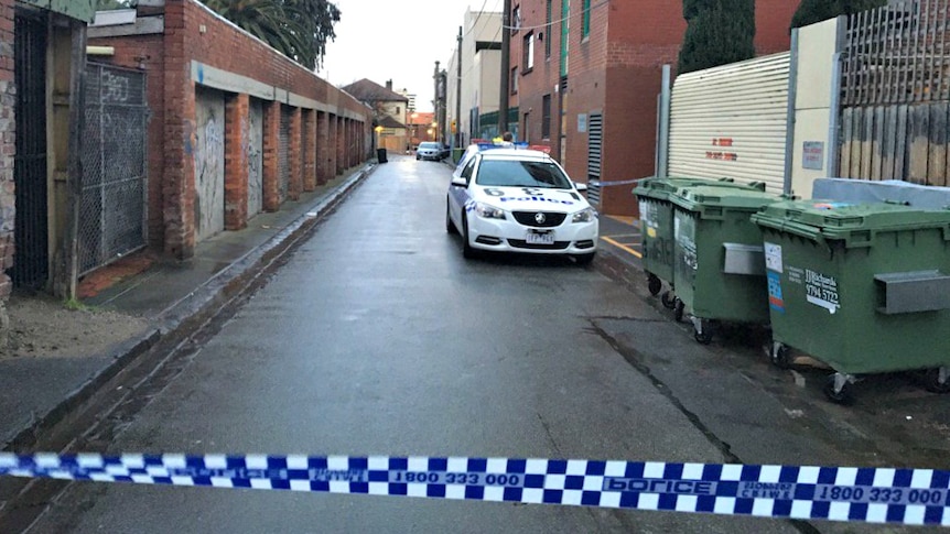 Police at St Kilda laneway after body found