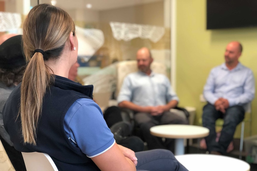 Participants in a ICU support group session