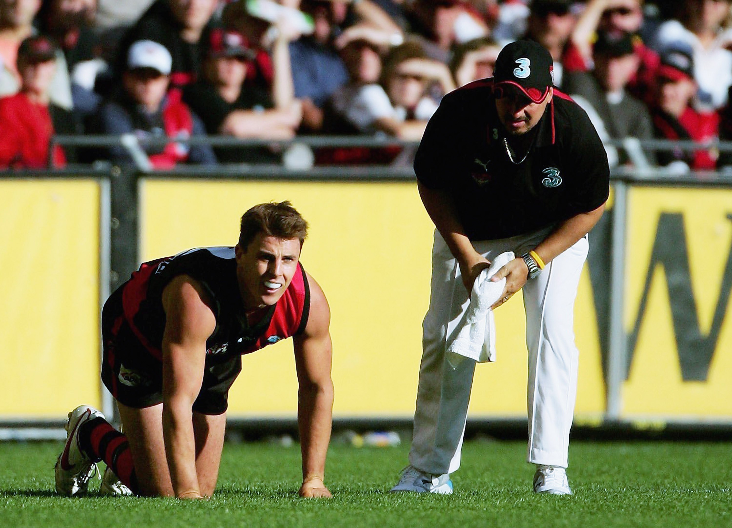 Matthew Lloyd on his hands and knees after tearing hamstring