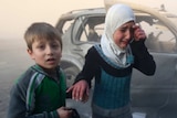 Syrian children near the site of a bomb attack in Aleppo