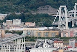 A wide, high view shows the length of collapsed part of the Morandi bridge.