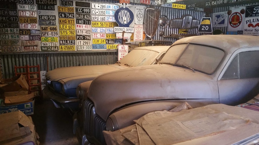 Cars found covered in dust inside a garage at Graeme Phillips' Alice Springs home