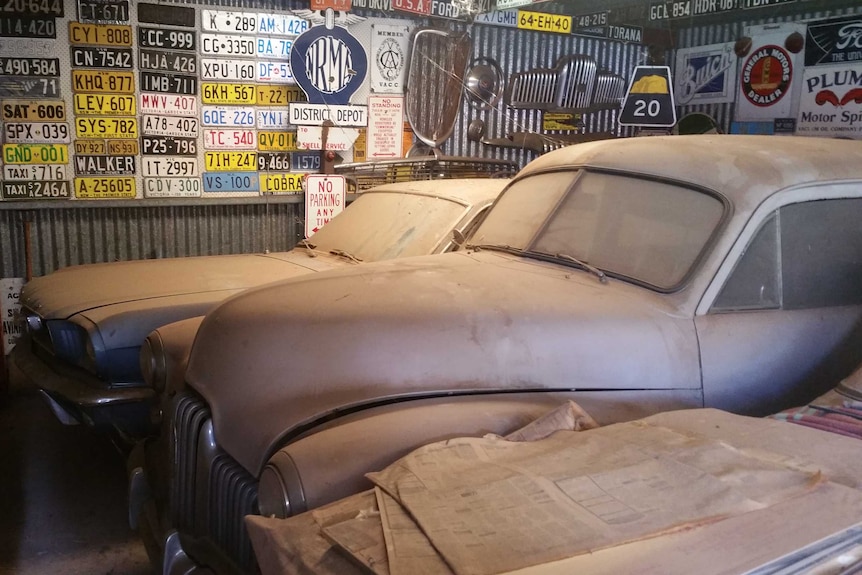 Cars found covered in dust inside a garage at Graeme Phillips' Alice Springs home