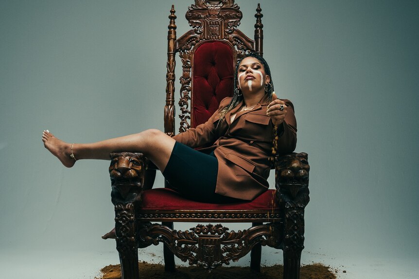 Lady laying across throne