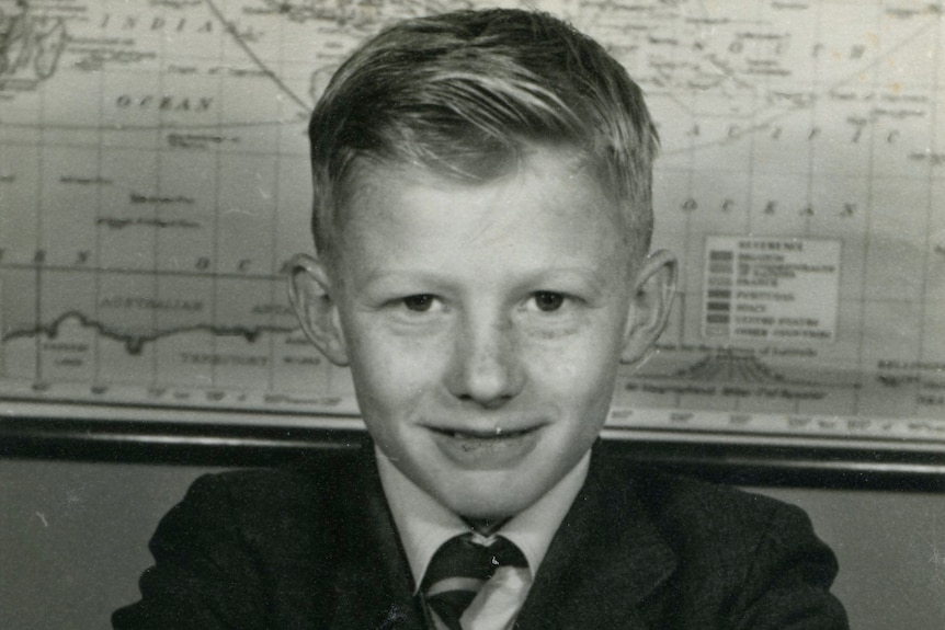 A black-and-white school photo of a young boy, circa 1958.