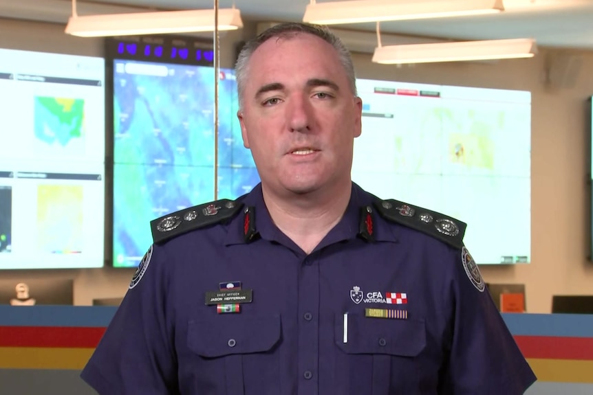 Screengrab of man in Country Fire Authority uniform giving a television interview in bushfire headquarters