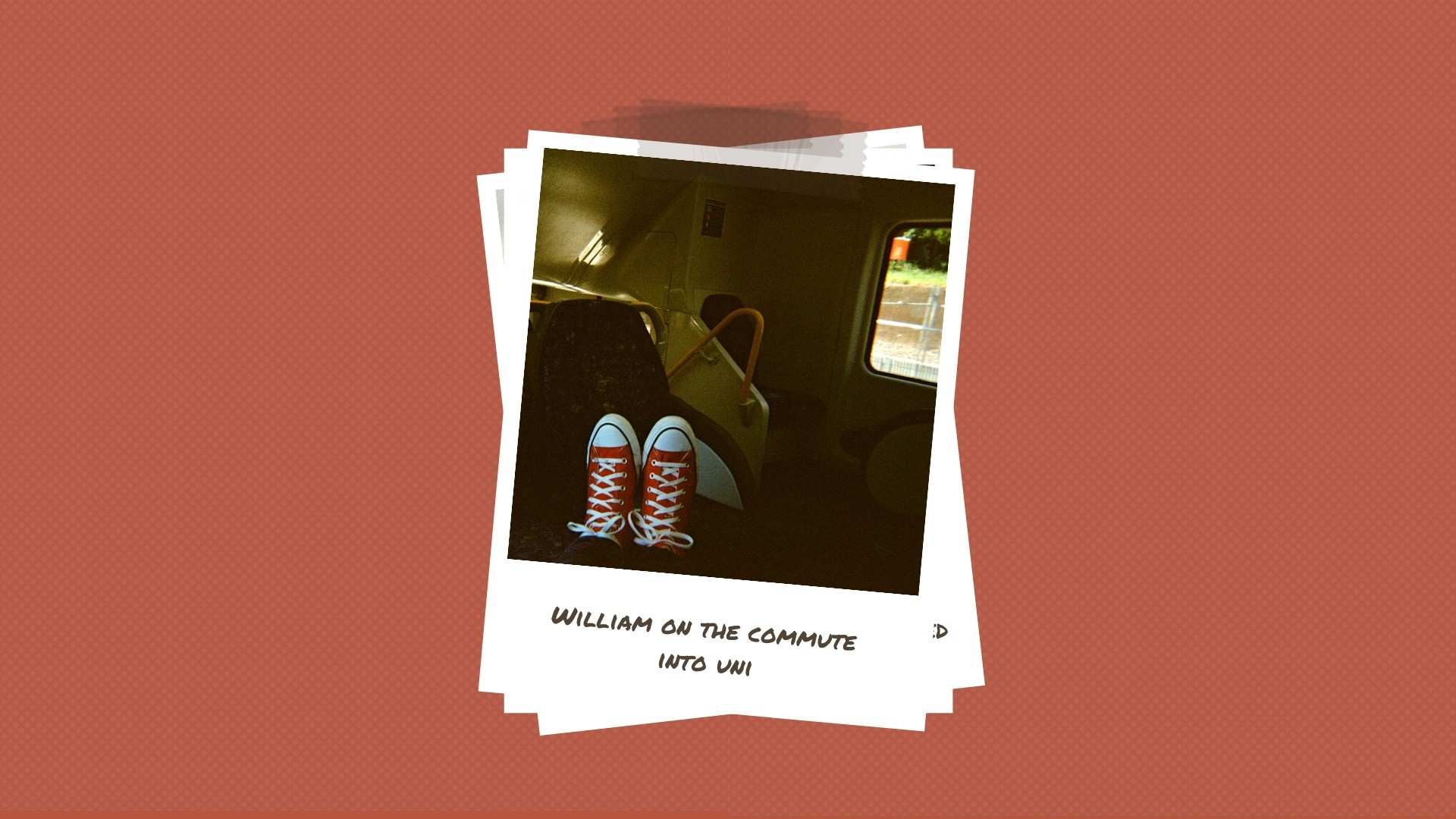 A man wears red Converse sneakers on a train