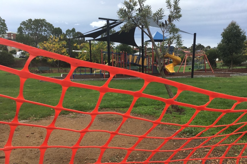An orange plastic barricade at a playground in Tasmania