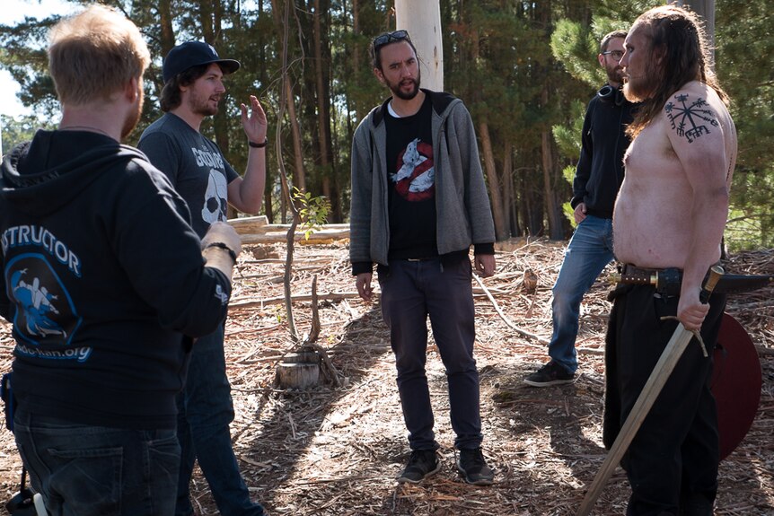 Producers Nicholas Cleary (hat) and Andrew Shanks (sunglasses) talk to one of the cast.