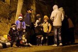 Children in the Syrian town of Madaya wait for food aid to arrive.