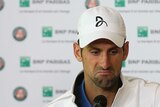 Novak Djokovic looks miserable after being knocked out of French Open