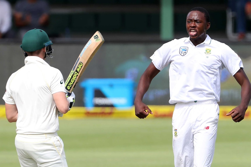 Rabada flexes in front of Steve Smith.