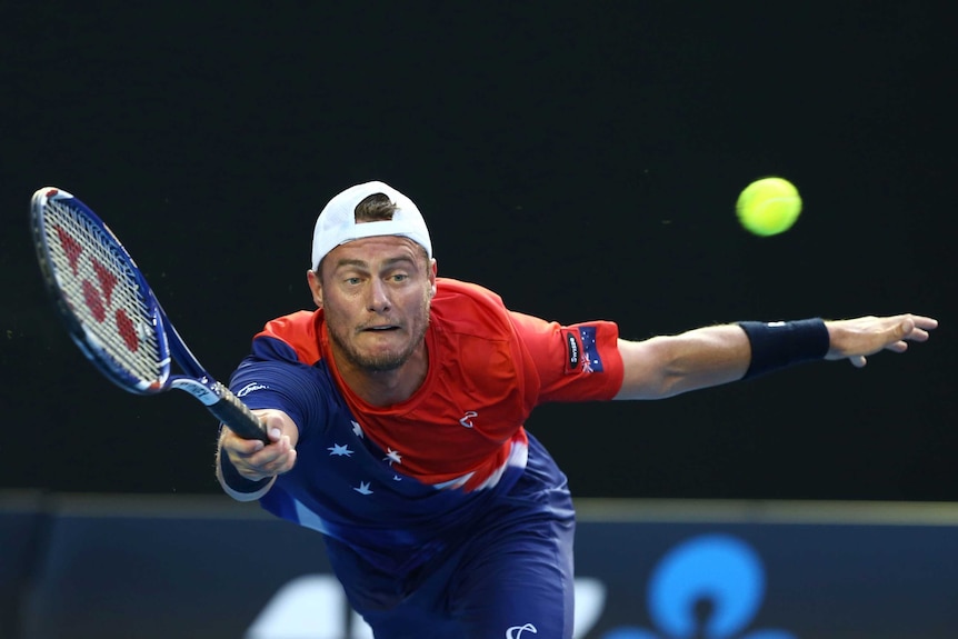 Always trying ... Lleyton Hewitt stretches for a forehand against David Ferrer