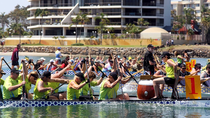 Competitors race during the Kids in Need Dragon Boat Festival held in Jack Evans Boat Harbour.