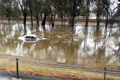 A car trapped in floodwaters near the Hume Freeway north of Wangaratta.
