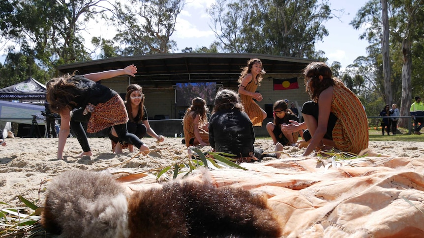 Gunaikurnai children playing in the sand at the announcement event at a nature reserve