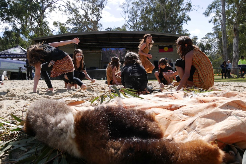 Gunaikurnai children playing in the sand at the announcement event at a nature reserve