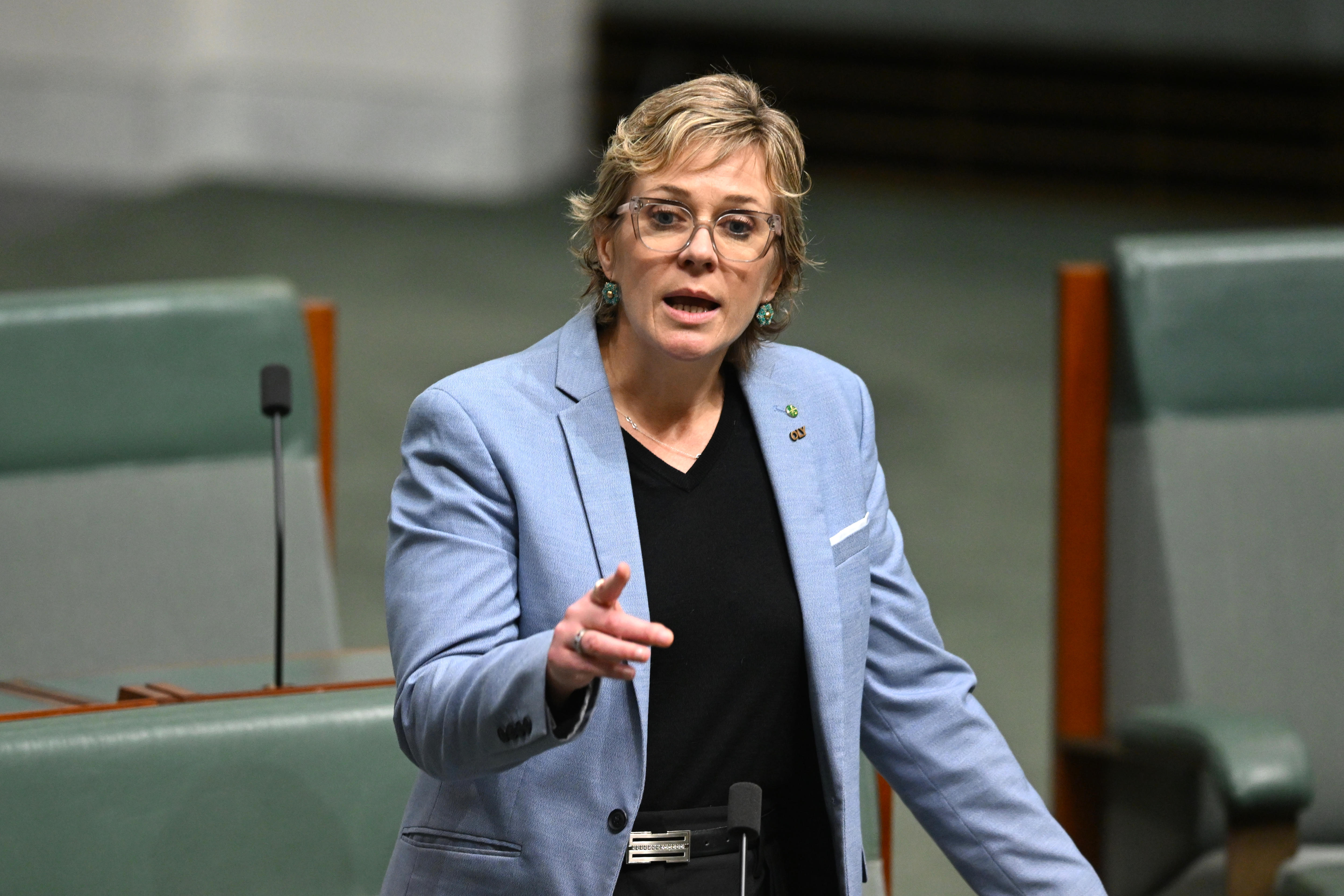 Zali Steggall standing with her finger pointed in Parliament House.
