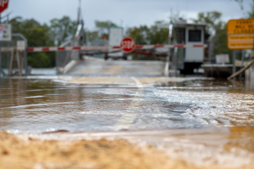 River Murray water overflows onto bitumen.