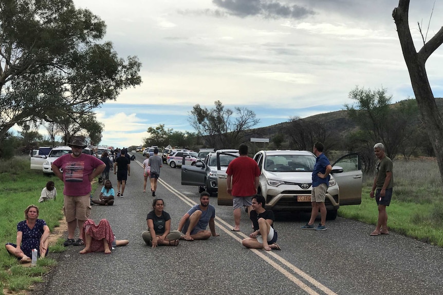 People wait for word after two tourists were swept away at the Hugh River in Central Australia