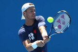 Australia's Lleyton Hewitt hits a ball during training at the Australian Open on January 18, 2016.
