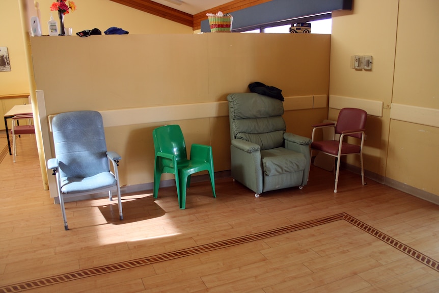 Empty chairs in a line at an Oakden nursing home.