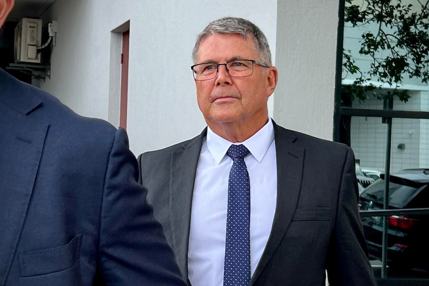 Man in suit outside court 