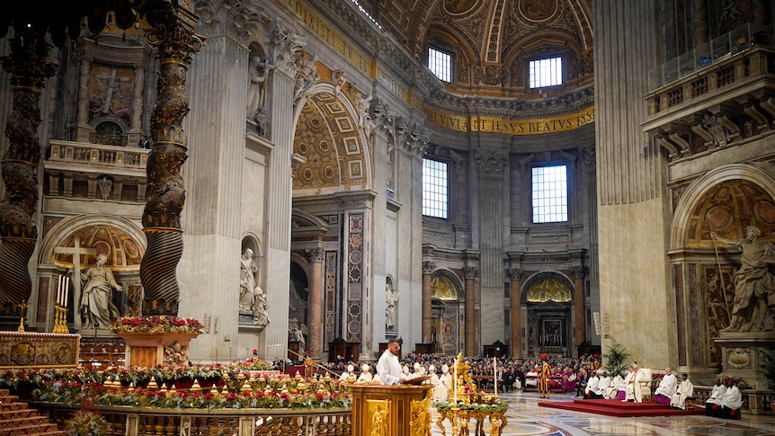 grand view inside st peter's basilica in the vatican where mass is taking place