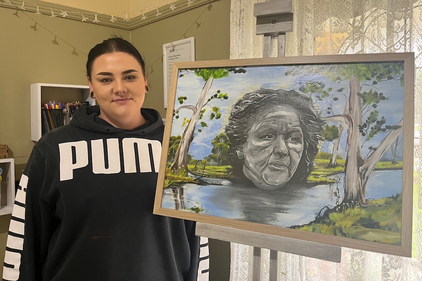 Artist Montana McStay with her artwork