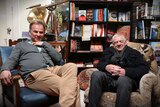 Author Neal Drinnan and Bob Perry sit in Neal's bookshop on low chairs