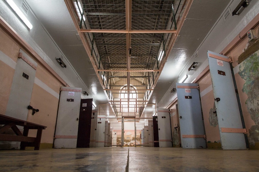 Looking down a corridor inside a cell block.