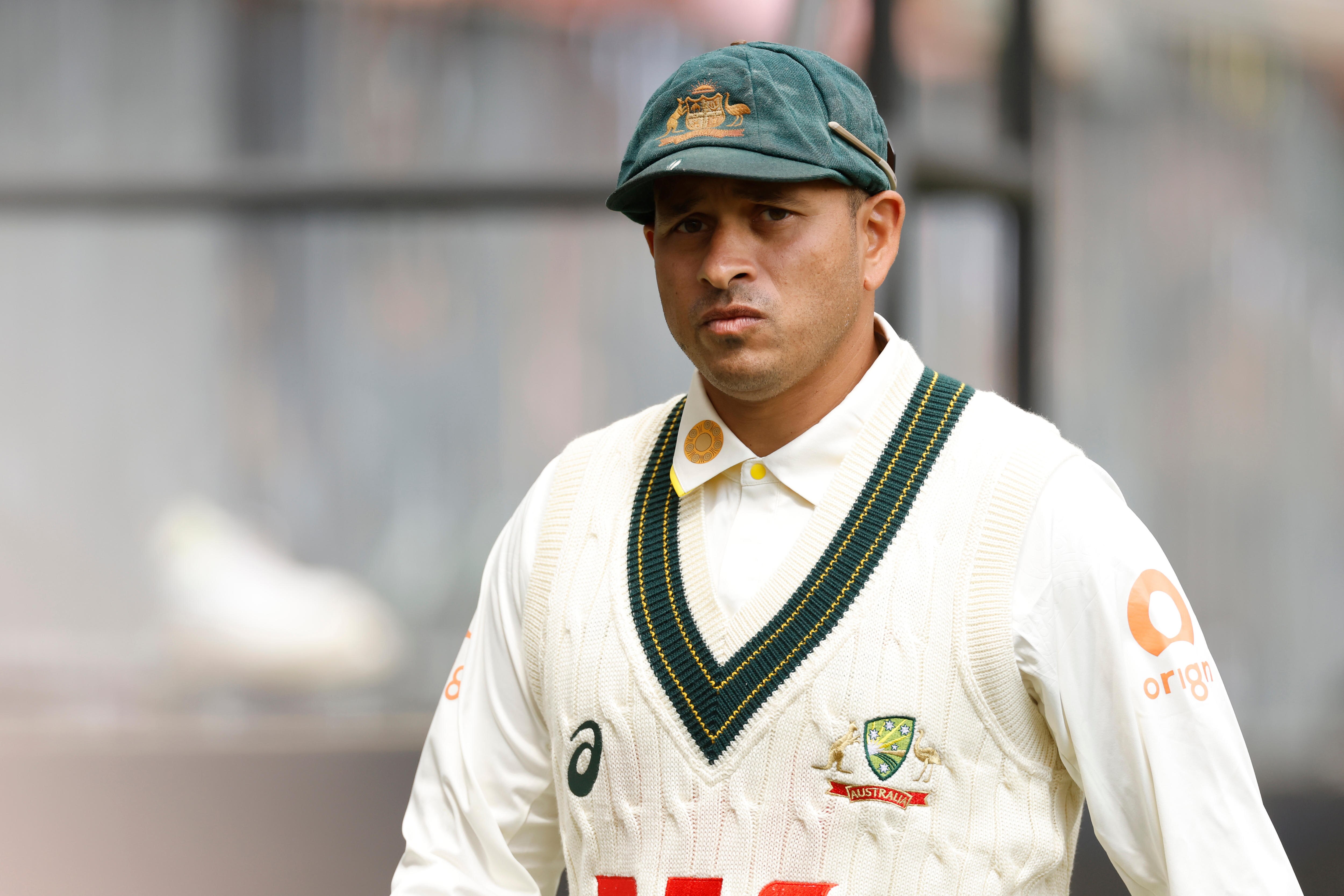 Usman Khawaja walks off the field during an Ashes Test.