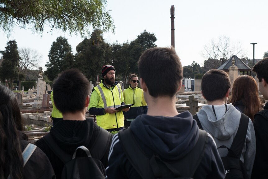 Ross Whitfield runs through the history of the site with AHS students.
