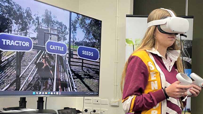 Girl in maroon and yellow shirt using virtual reality googles 