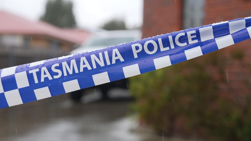 Tasmania Police tape at crime scene.